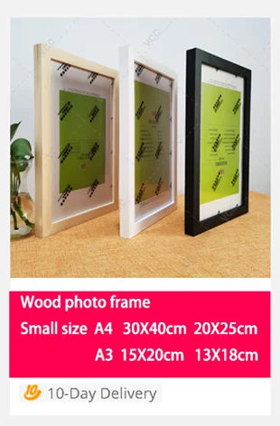 A set of wooden photo frames in various sizes, including A4 and A3, displayed on a light brown surface.