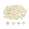 A pile of assorted white snap buttons measuring 12mm and 10.5mm for crafting.