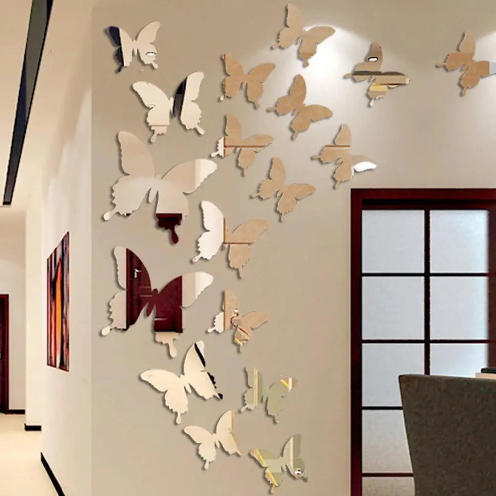 A gallery wall featuring a collection of light brown and beige butterfly-shaped mirror effect stickers mounted on a white wal