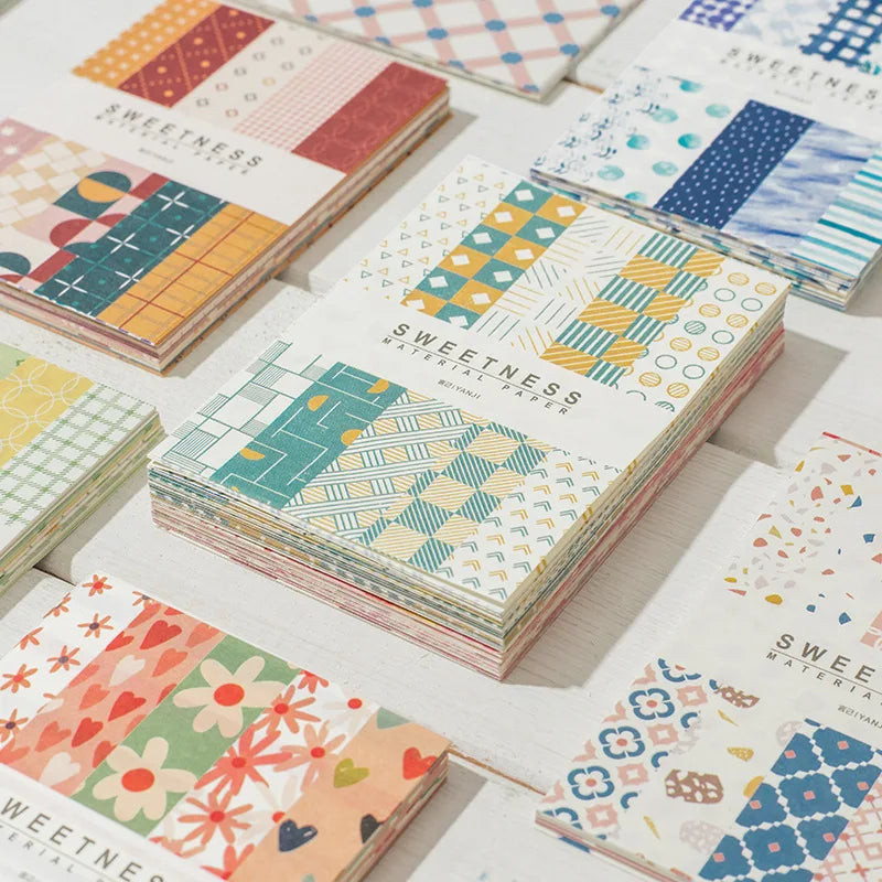 A collection of decorative memo pads and cards in various patterns and colors for a journal paper pack