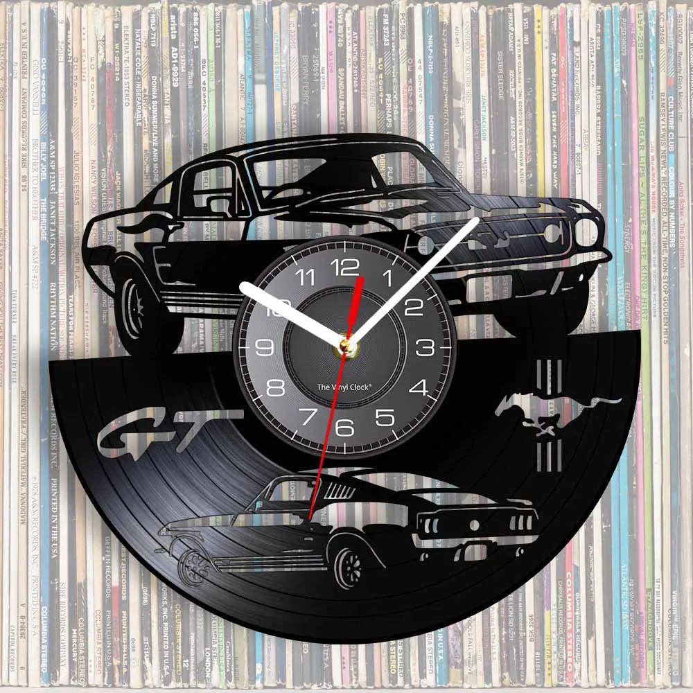 A wall clock featuring a black silhouette of a sports car and a vinyl record design.