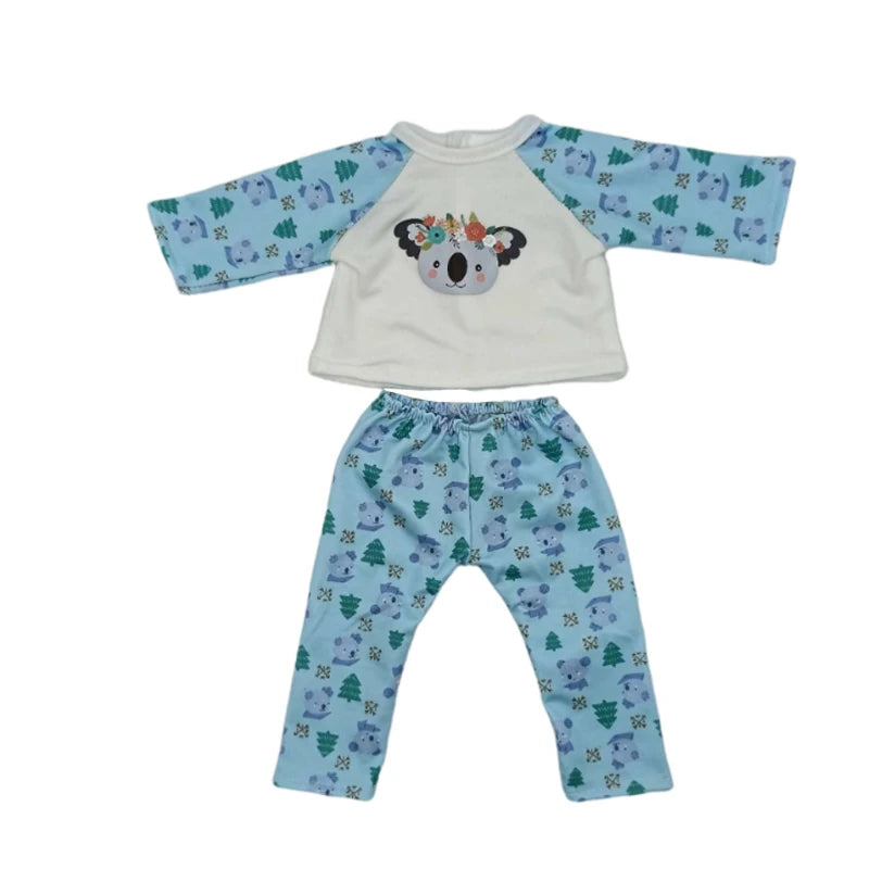 A light blue and white outfit set for a doll, including a top and matching pants.