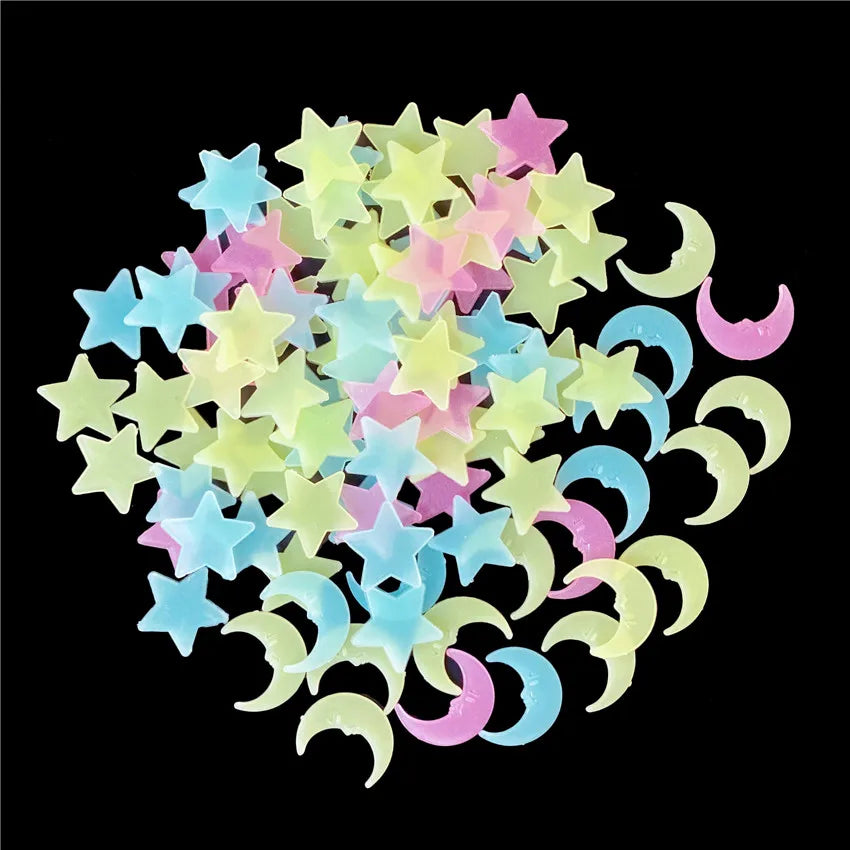 A collection of glow-in-the-dark star and crescent moon wall stickers in various pastel colors.