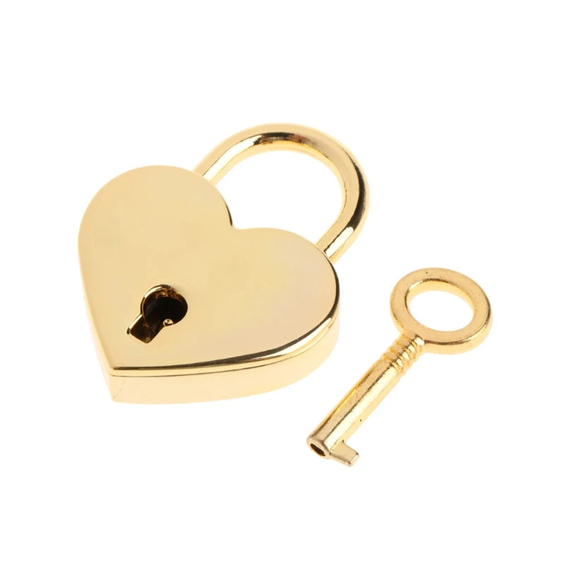 A vintage gold heart-shaped mini padlock and key set.