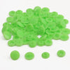 A pile of assorted light green snap buttons, measuring 12mm and 10.5mm, for crafting.