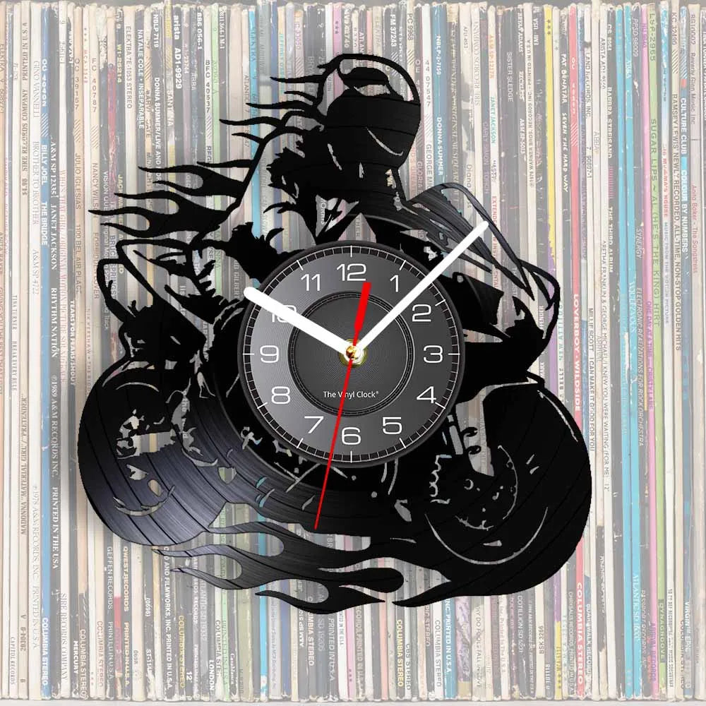 A black silhouette of a motorcycle rider forms the frame around a round vinyl record wall clock.