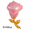 Globo de rosa con papel metálico rosa y tallo y hojas doradas