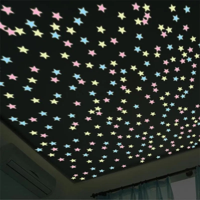 A ceiling decorated with glow-in-the-dark star wall stickers in various pastel colors against a dark background.