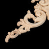 A close-up of a light oak wood corner carving featuring an ornate branch and crown design.
