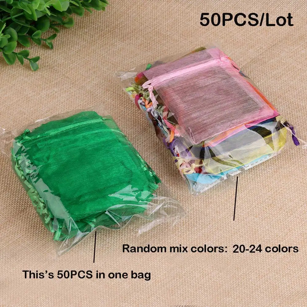 A bag containing 50 pieces of random mix colored organza drawstring gift pouches for jewelry and favors.
