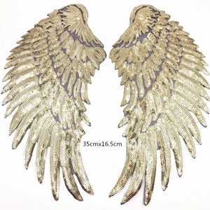 A pair of large gold sequin wing patches for DIY sew-on or iron-on embellishment.