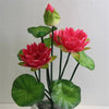 Artificial lotus flower bunch with vibrant pink and red blooms and green leaves