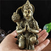 Bronze Hanuman statue figurine of a monkey god held in a praying mudra, displayed in a hand.