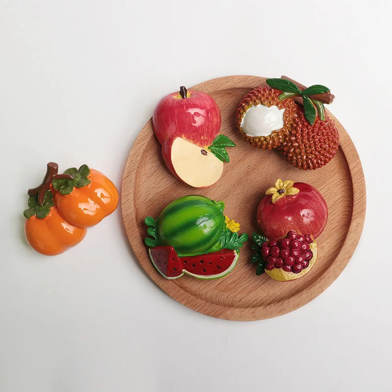A set of realistic, cute 3D fruit and vegetable fridge magnets including an apple, a pomegranate, a pumpkin, and a strawberry