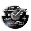 A wall clock featuring a black and white sports car design, including a GT logo and a detailed car illustration.