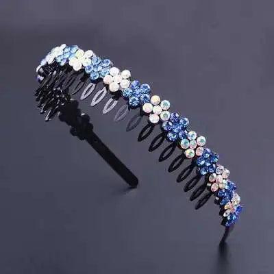 A headband adorned with small crystal and rhinestone flowers in shades of blue and white.