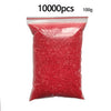 A bag of 10,000 red fuse beads for DIY crafting projects.