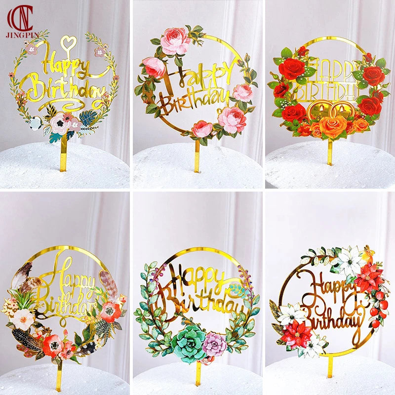 Rose gold acrylic wreath with flowers and gold lettering for a happy birthday cake topper
