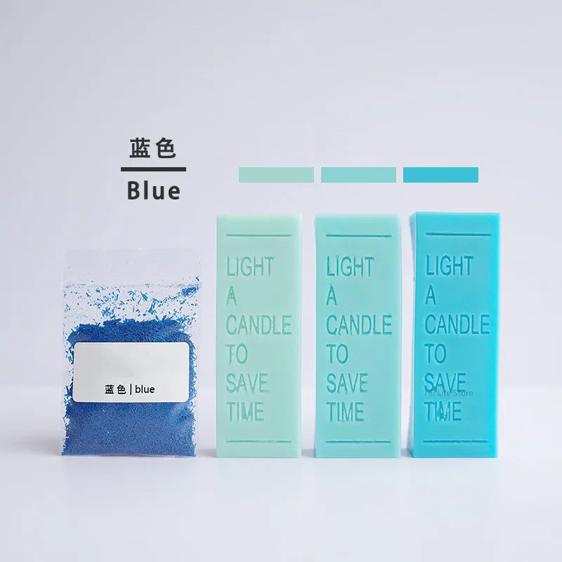 A set of blue candle colorants and light blue glass tubes demonstrating different shades of blue for DIY wax projects.
