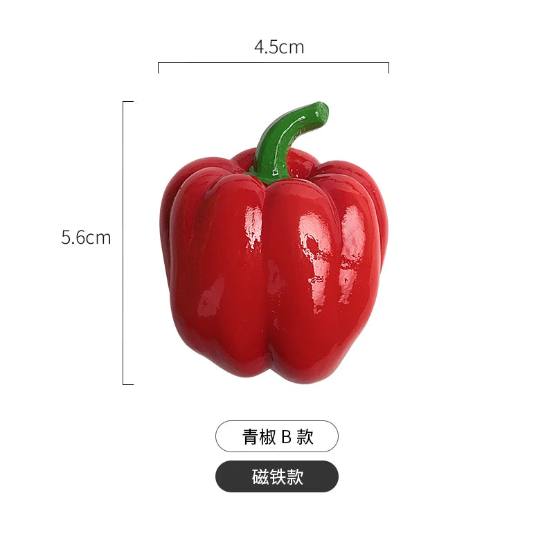 A realistic red bell pepper with a green stem, used as a fridge magnet.