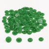 A pile of assorted green snap buttons, measuring 12mm and 10.5mm, for crafting.