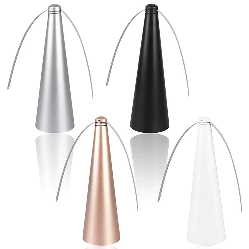 A set of four automatic electric fly repellent fans in silver, black, rose gold, and clear glass.