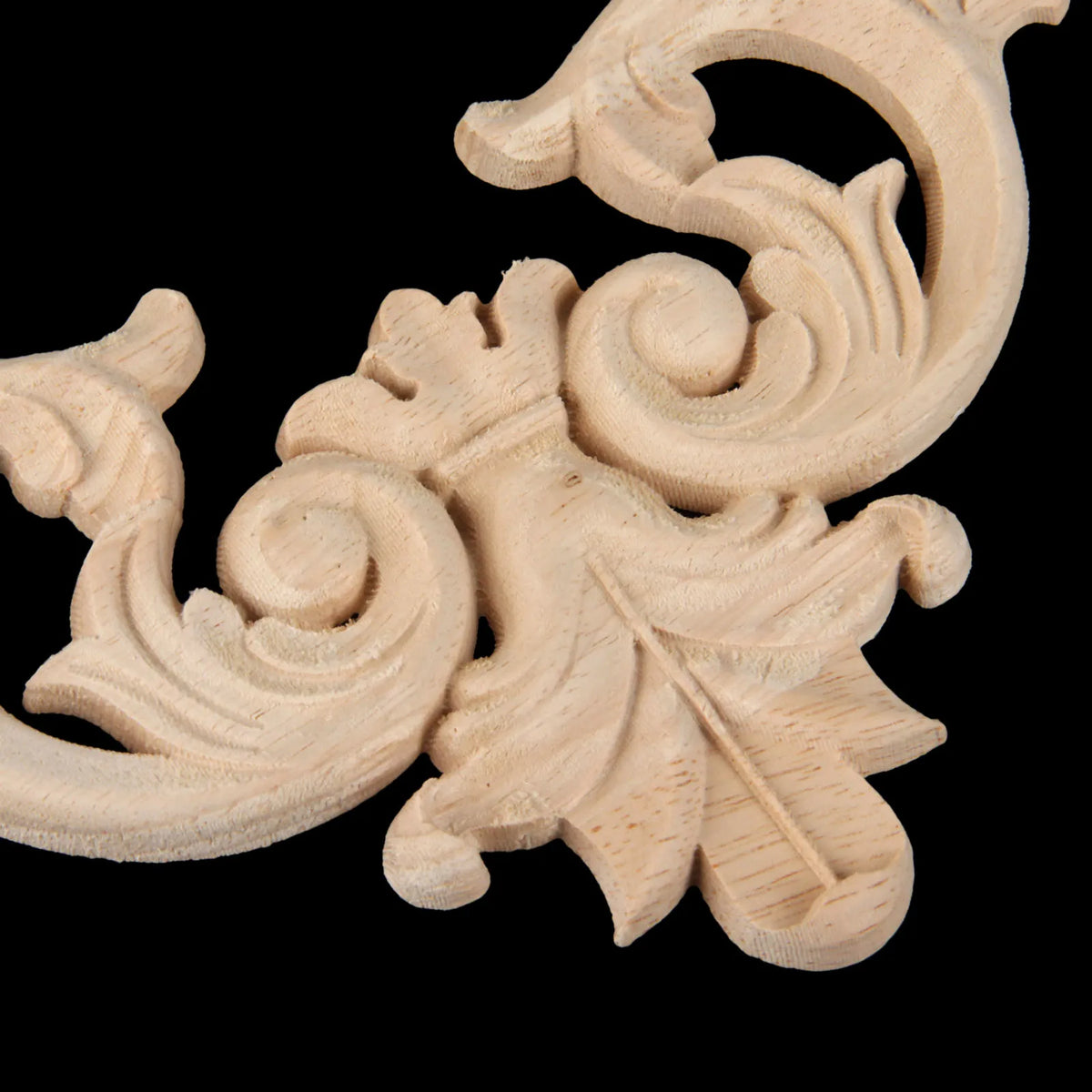 Set of two oak wood corner carvings featuring European branch and crown decorative motifs