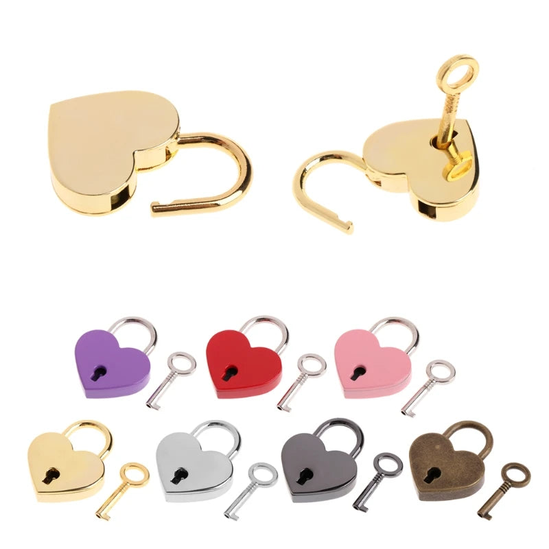 A collection of vintage heart-shaped mini padlocks and keys in gold, purple, red, pink, silver, and bronze finishes.