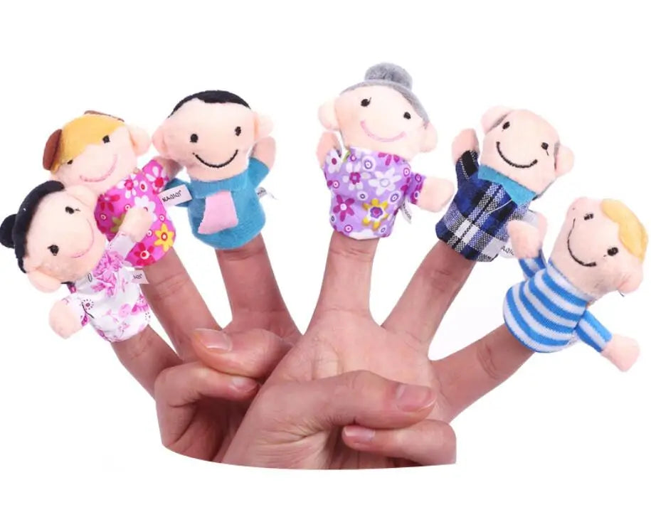 A hand holds a set of plush finger puppets depicting a family of cartoon animals.