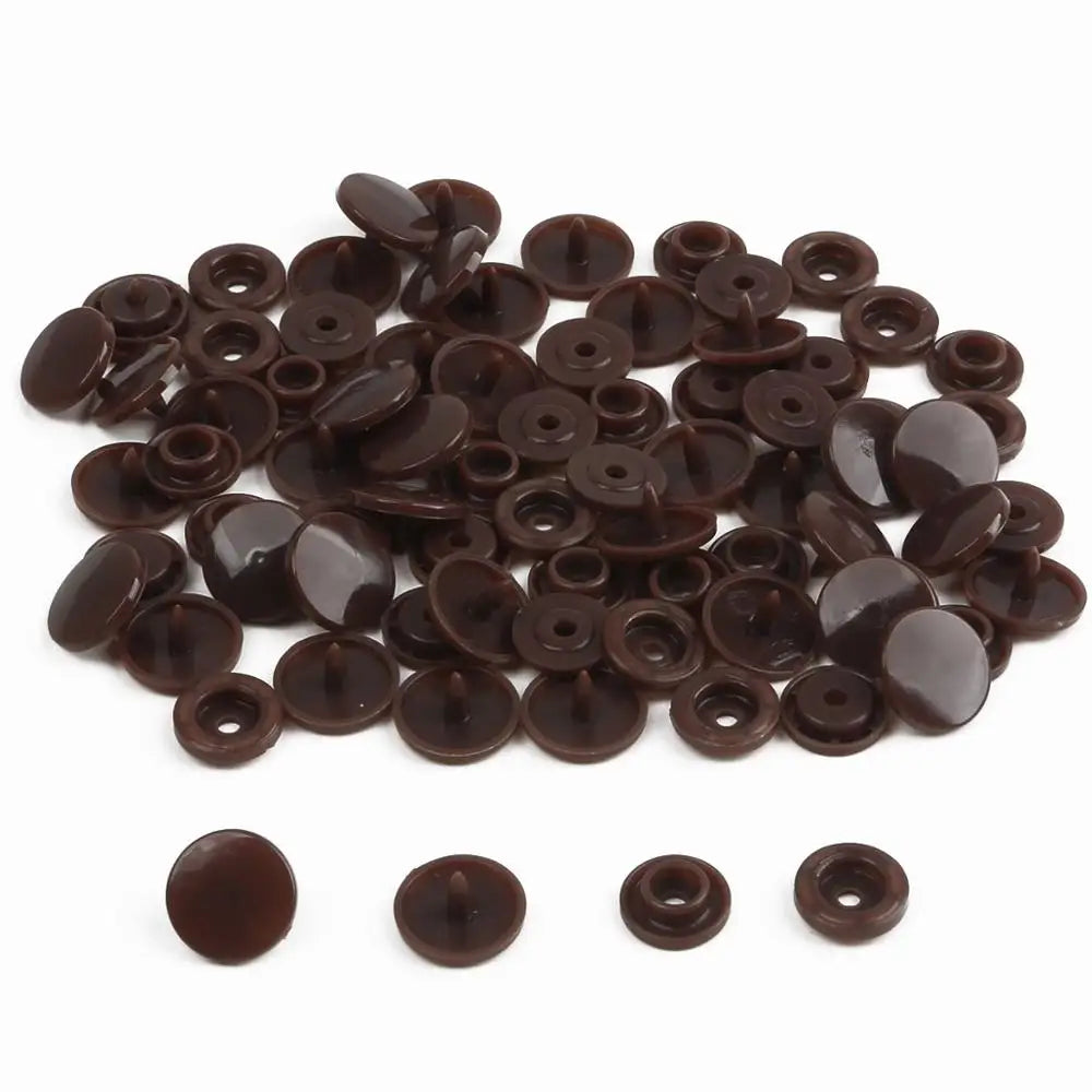A pile of assorted dark brown snap buttons, measuring 12mm and 10.5mm, for crafting.