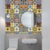 A bathroom wall decorated with colorful retro Moroccan tile stickers surrounding a circular mirror above a sink and toilet.
