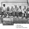 Black and white canvas painting depicting a group of men sitting on a ledge overlooking a New York City skyline.