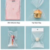 Various clear cellophane gift bags with gold twist ties for presentation