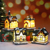 A set of three festive Christmas house night lights with warm LED glow illuminating miniature houses against a blurred bokeh 