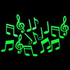 A set of glow-in-the-dark musical notes shaped like stars and moons against a black background.