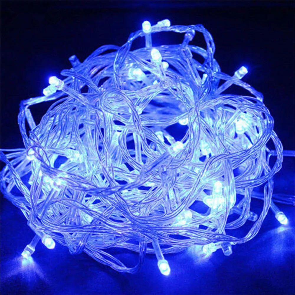 A tangled bundle of bright blue LED string lights used for holiday decoration.