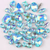 A mix of iridescent blue and green glass rhinestones set in silver claws.