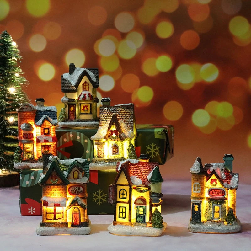 A collection of festive Christmas house night lights featuring warm LED glow and detailed miniature houses.
