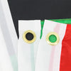 Close-up of a white flag with red and pink stripes, featuring gold grommets on the edge.