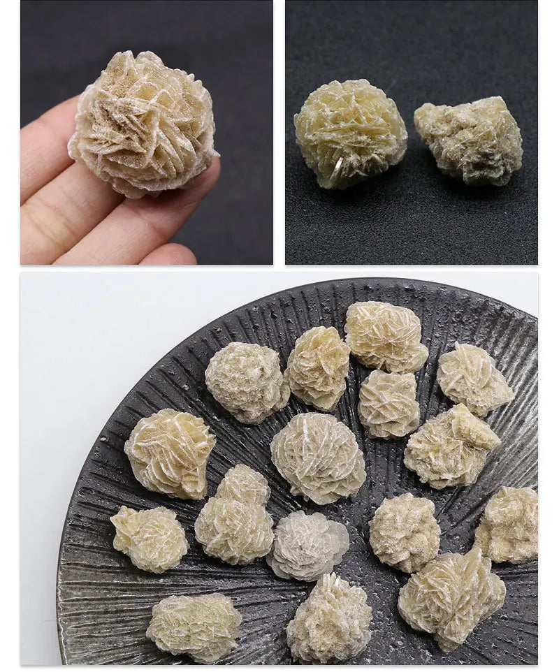 A collection of natural desert rose selenite stones in various sizes and textures displayed on a dark slate surface.