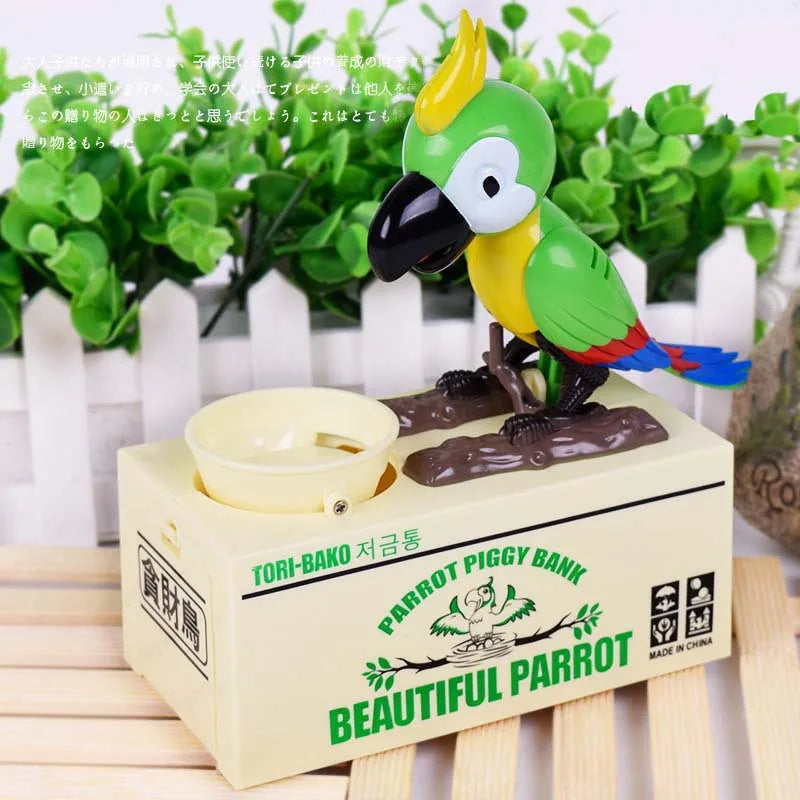 A ceramic parrot bank featuring a greedy bird design, colored green and yellow, displayed on a light-colored box.