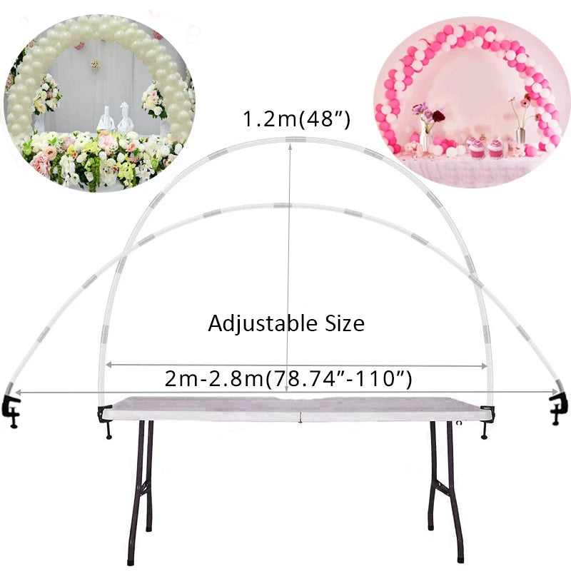 A silver adjustable balloon arch column stand with a pink floral backdrop and a rectangular table top.