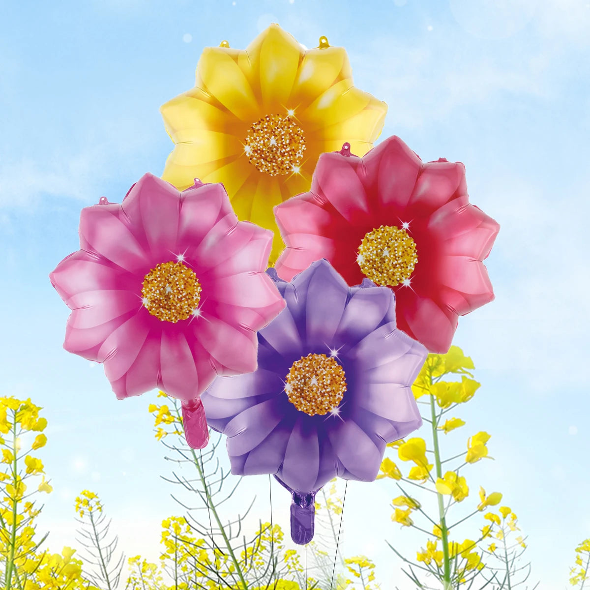 A bouquet of ten heart-shaped foil balloons in shades of yellow, pink, and purple against a blue sky.