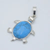 A silver pendant necklace featuring a round, bright blue natural stone with white veining shaped like an animal.