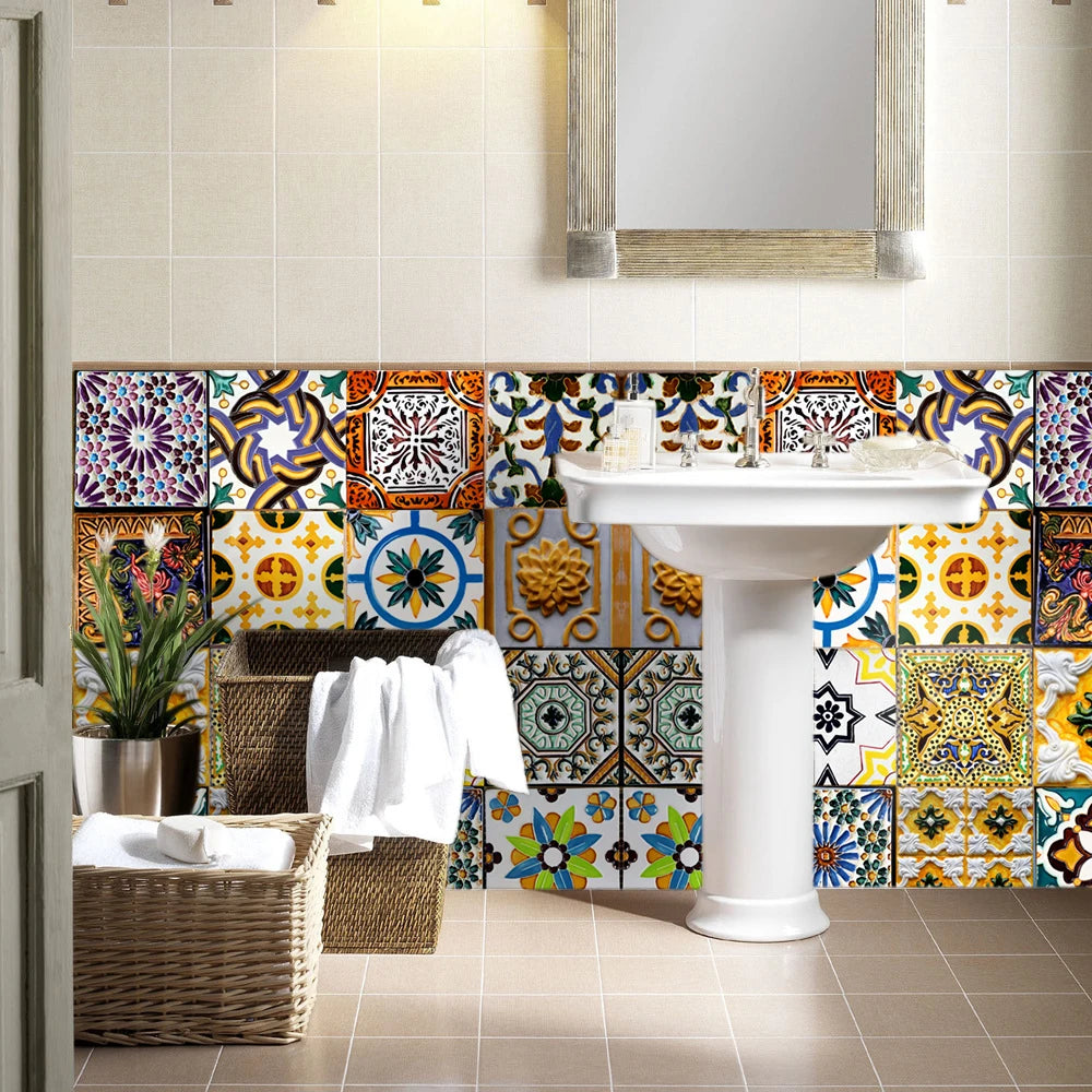 A white pedestal sink with colorful Moroccan tile backsplash and a mirror above it.