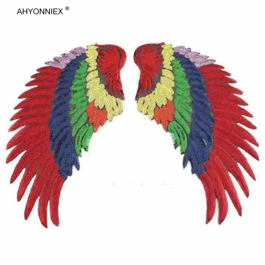 A pair of large sequin wing patches featuring a vibrant rainbow color gradient.