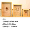 A set of three vintage wooden photo frames featuring silhouette designs of cats on a light wood background.