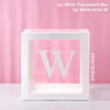 A white transparent box with a large white letter W inside, displayed against a pink background.