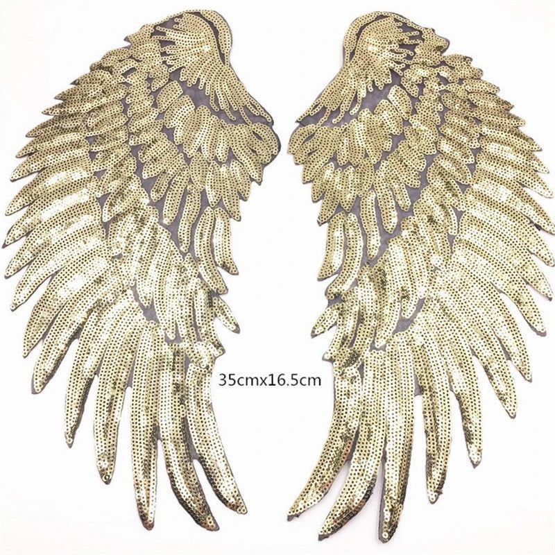 A pair of large gold sequin wing patches for DIY sew-on or iron-on embellishment.