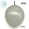 A smooth, grey latex balloon is shown against a white background.